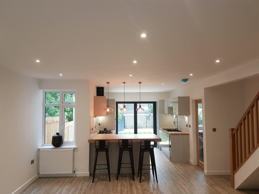 Open-plan kitchen and dining, with the new staircase