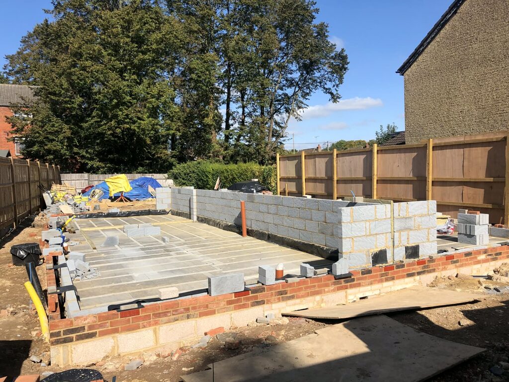 Project story: from old bungalow to two new family homes in Eastleigh Ground floor laid and the first blockwork going up