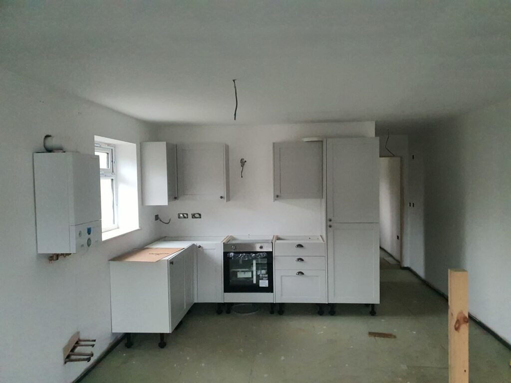 Project story: four new flats in Hampshire, from groundworks to handover A fitted kitchen going in