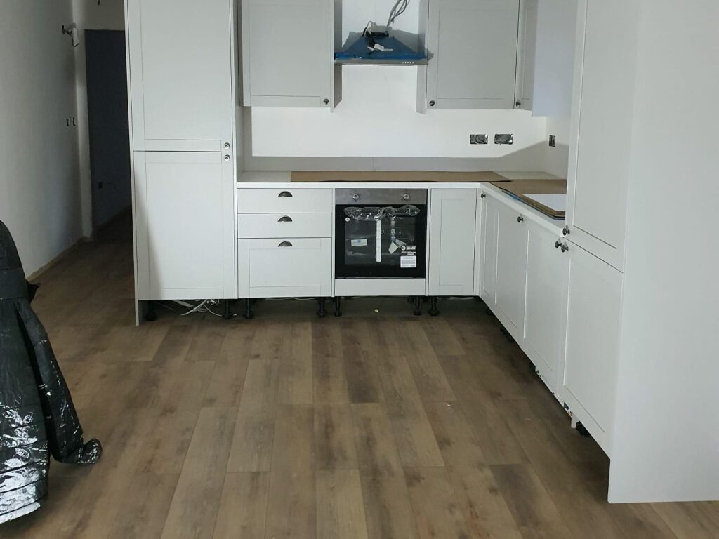 Project story: four new flats in Hampshire, from groundworks to handover Kitchen fitted, with the new flooring down