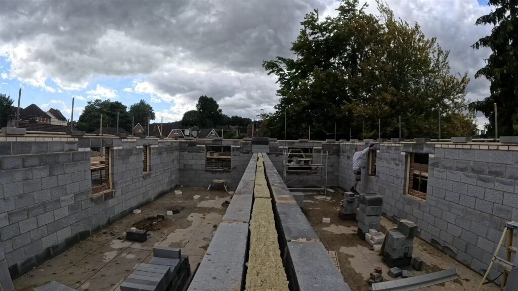 Project story: four new flats in Hampshire, from groundworks to handover Upper walls built to full height