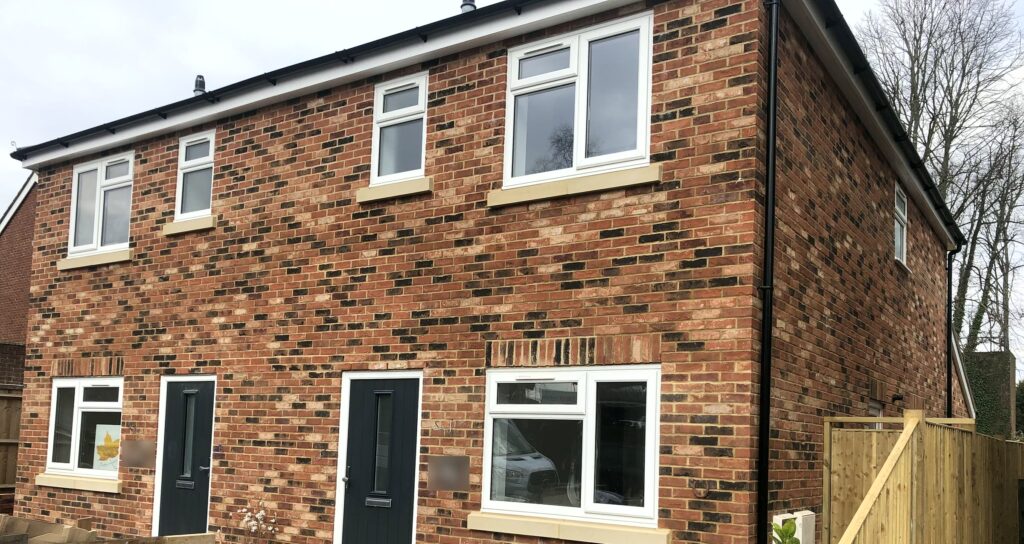Project story: from old bungalow to two new family homes in Eastleigh The finished pair of three-bedroom semi-detached homes in Eastleigh