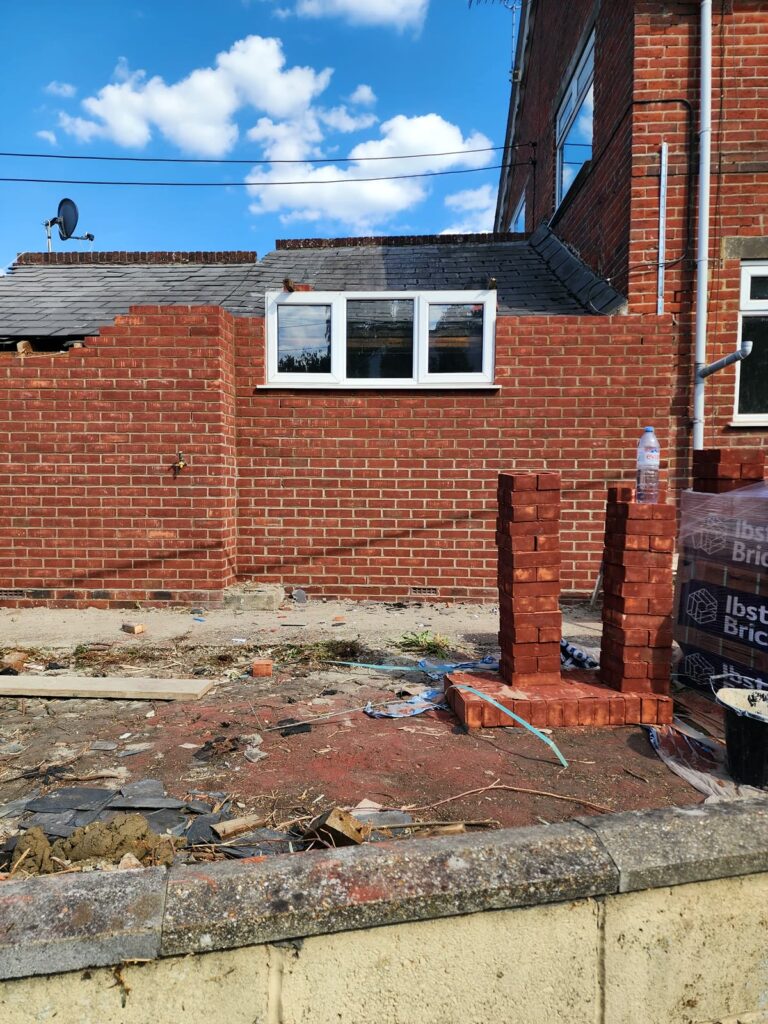 Project story: renovating a tired house, from extension rebuild to finished home The new walls going up, taller than before