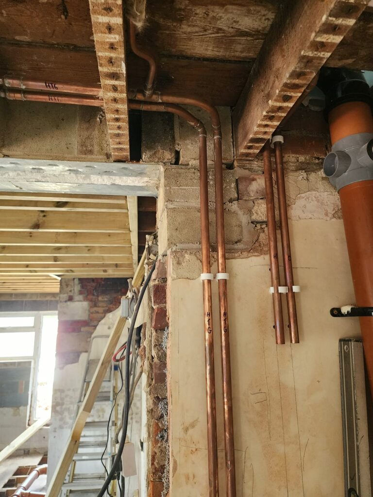 Project story: renovating a tired house, from extension rebuild to finished home New floor joists going in